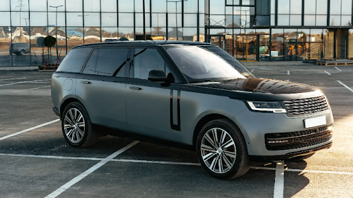 Best SUV NZ – Luxury SUV parked in front of a building